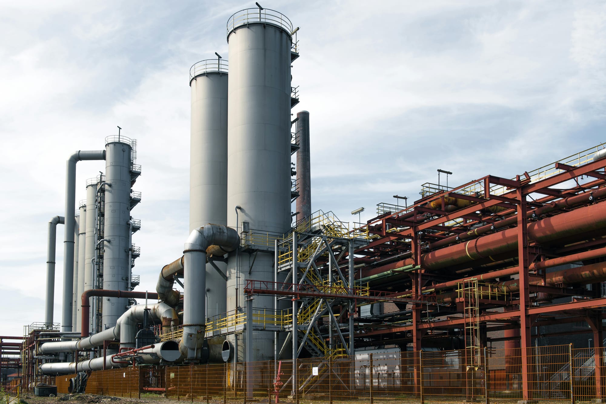 View of industrial refinery with overcast gray skies