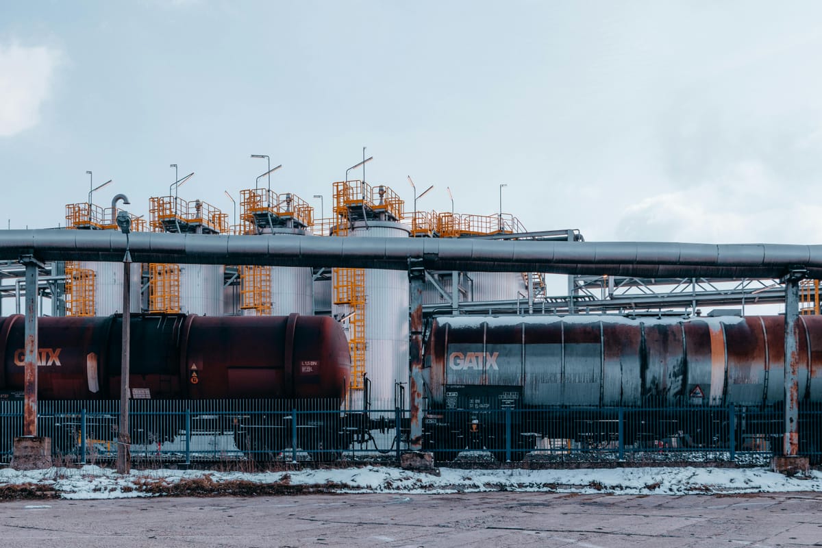 Oil refinery in winter, industrial trainyard.